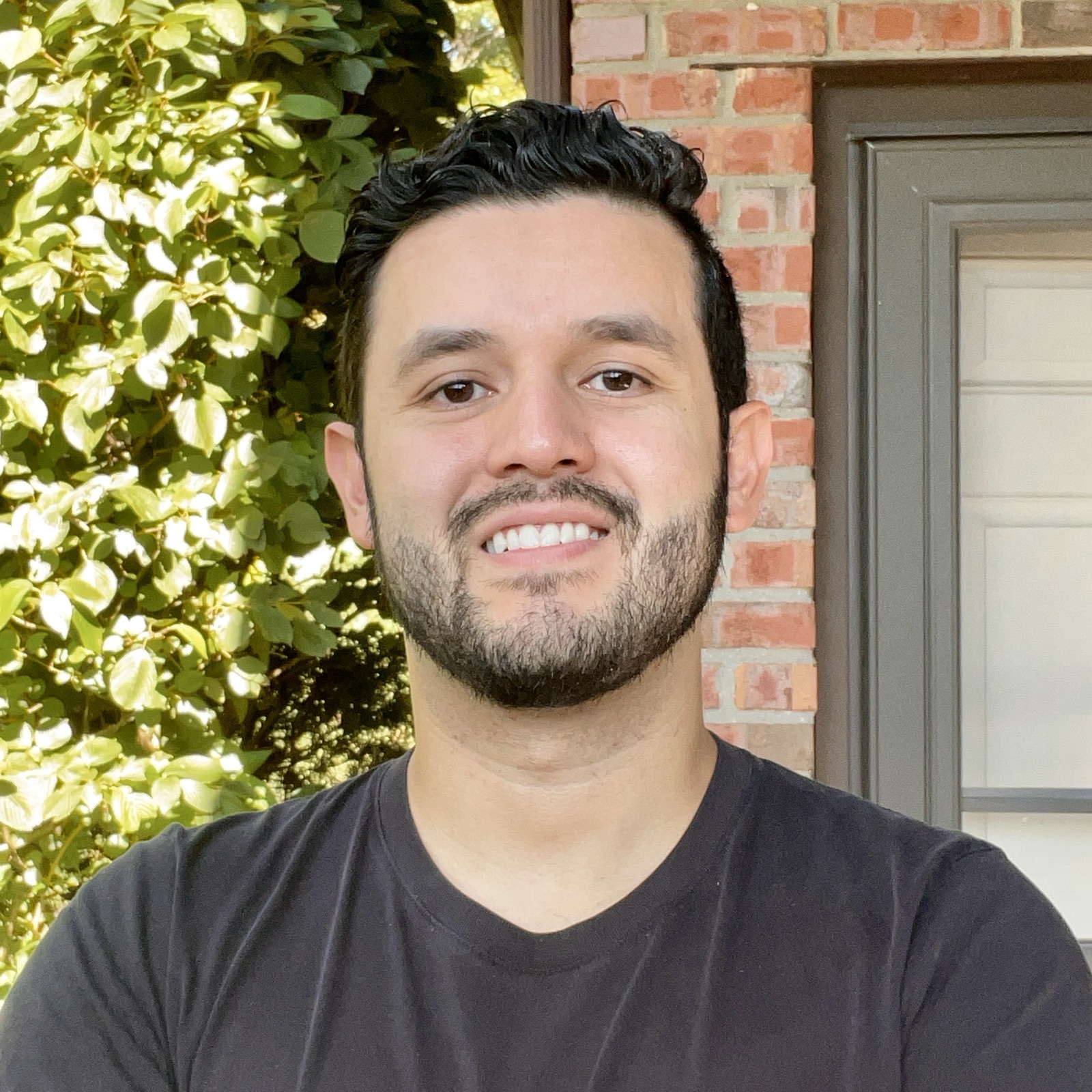 Eddie Cordera smiling outdoors
